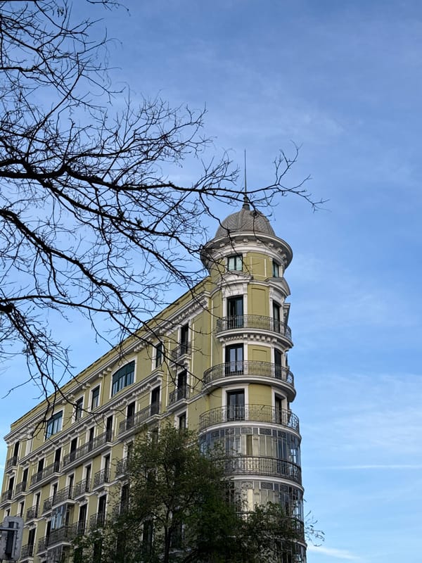 Madrid building with dome turret observed against spring sky