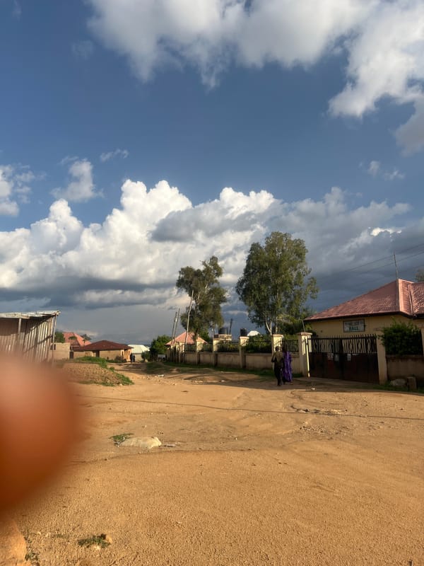 Daily life captured on dirt roads in Nigerian community