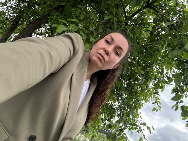Woman documents morning garden visit with tools in Chaikovsky