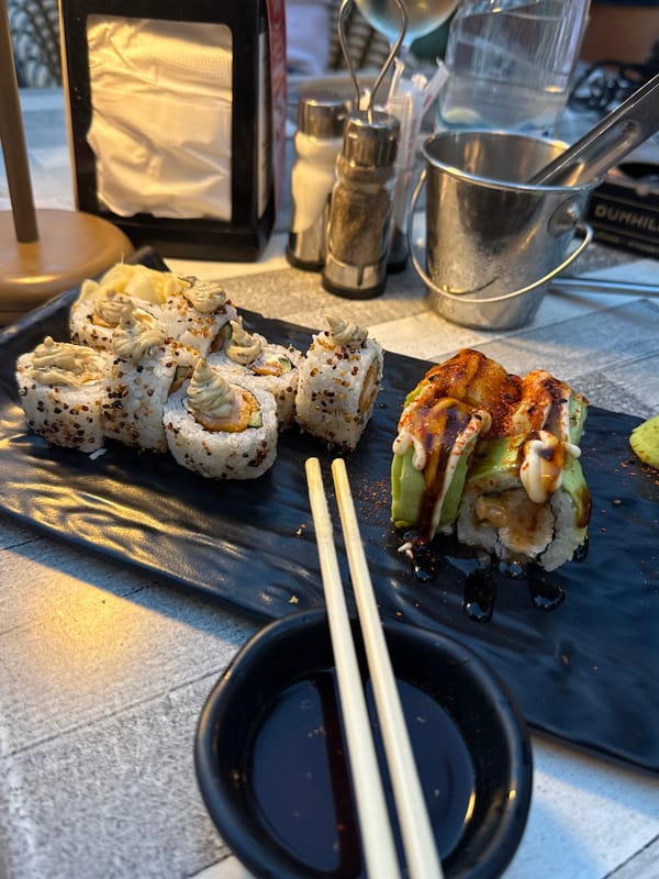 Sushi, salad, and marigolds at a Varna dining spot
