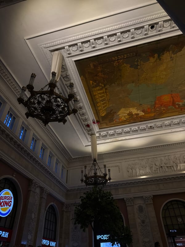Visitor photographed in ornate Saint Petersburg building interior