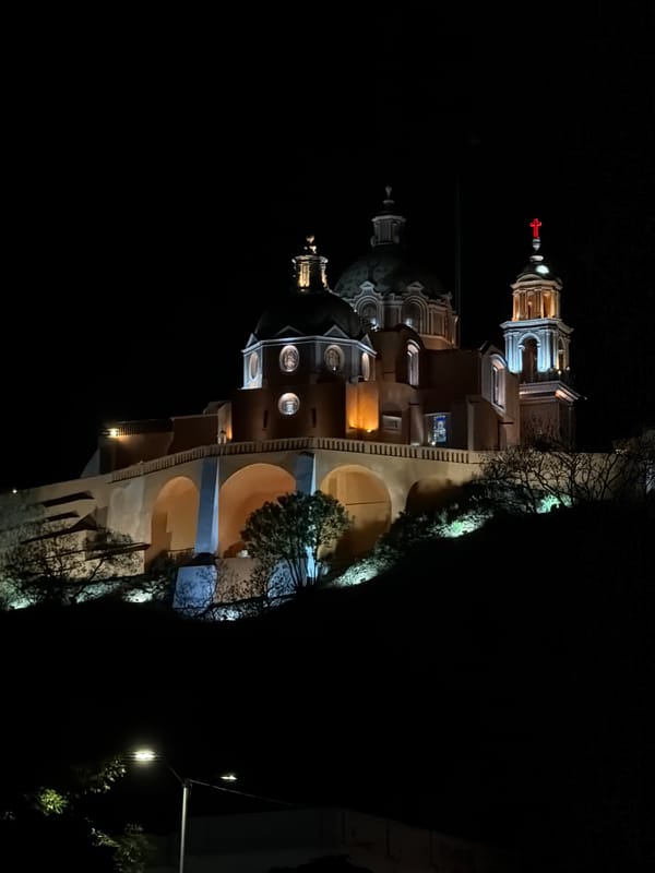 Nighttime photography session captures illuminated historic churches in Cholula