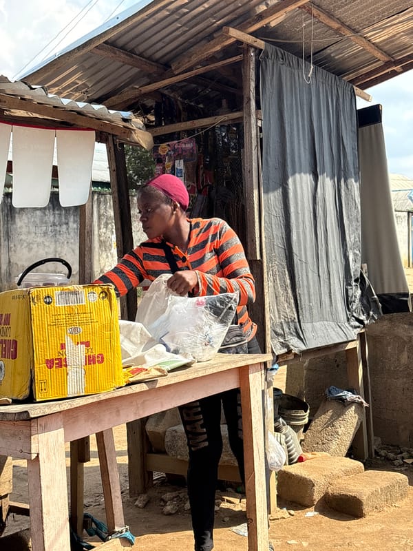 Water vendor takes break on tricycle in Ikot Ekpene