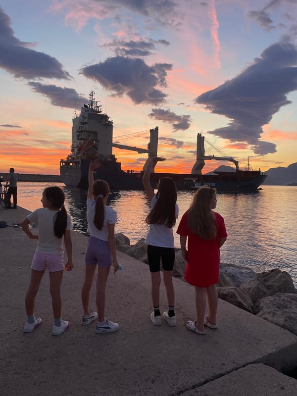 Sunset watchers gather at Bar Montenegro harbor pier