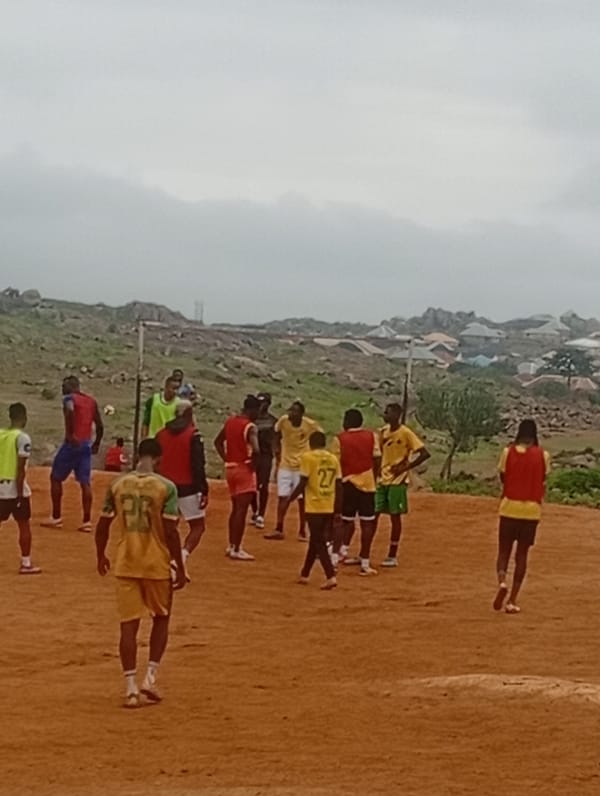 Pickup soccer on a rocky dirt field in Jos, Nigeria