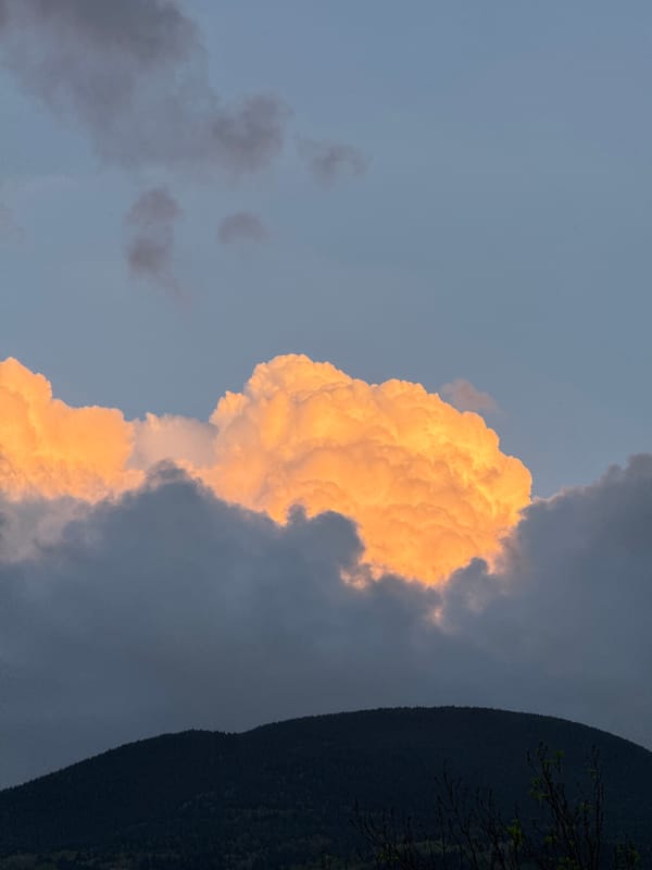 Dramatic illuminated cloud formation witnessed at sunset in Benasque