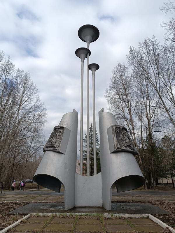 Three-pole metallic monument observed in Chaikovsky park