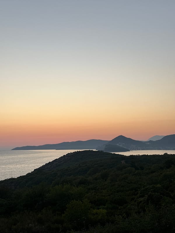 Sunset and a stone fountain in Drobnići, Montenegro