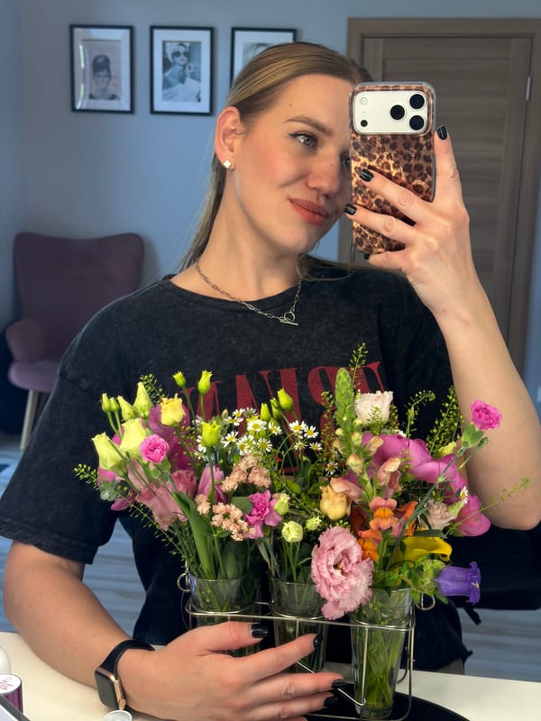 Woman documents afternoon with pet dog and flowers in Riga