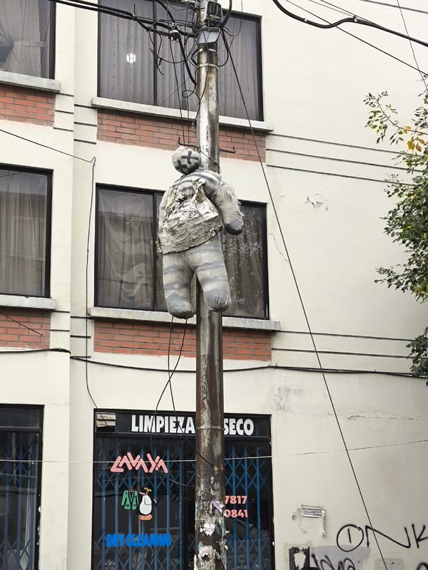 Clothed dummy tied to pole in La Paz