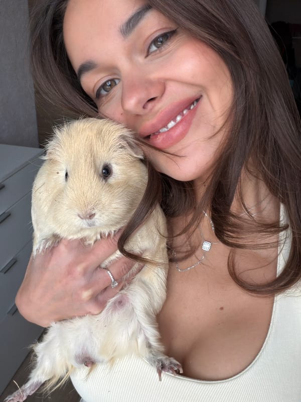 Woman poses with guinea pig in Krasnoyarsk