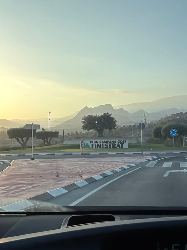 Golden morning light over Finestrat's hazy hills and mountains