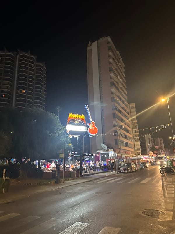 Benidorm's neon-lit nightlife strip after midnight