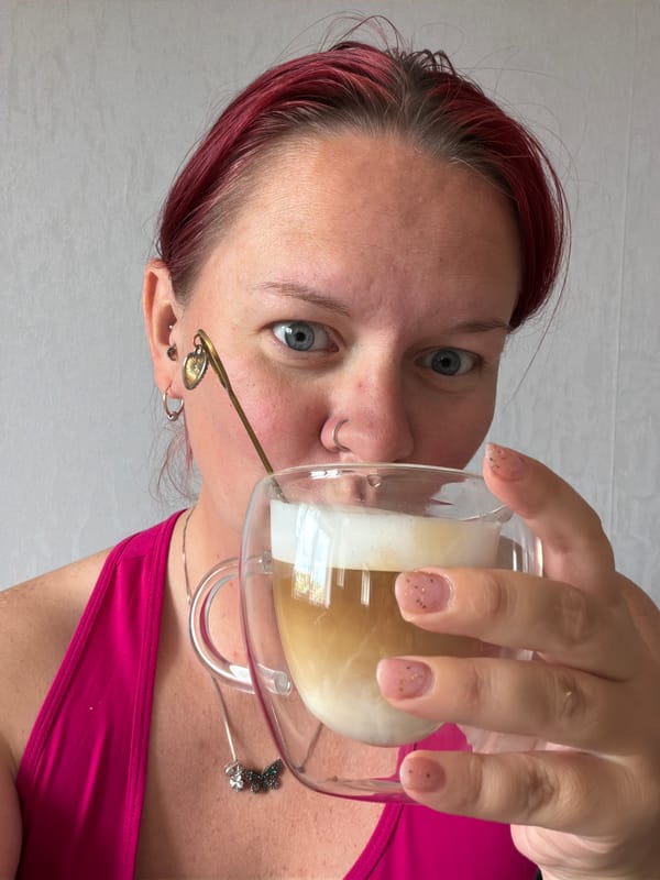 Person with drink, bread dough documented at same location