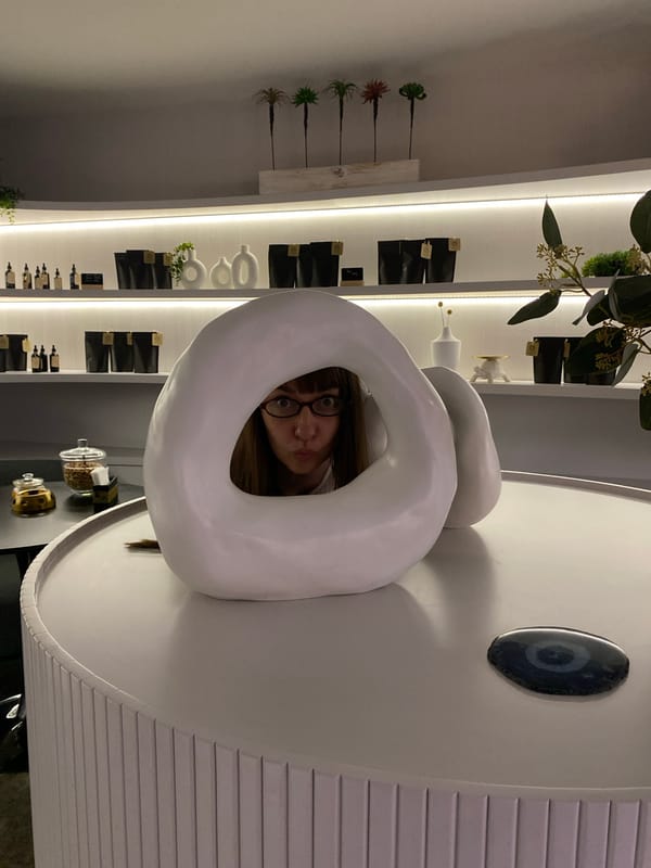 Woman peers through white ring object in Votkinsk store