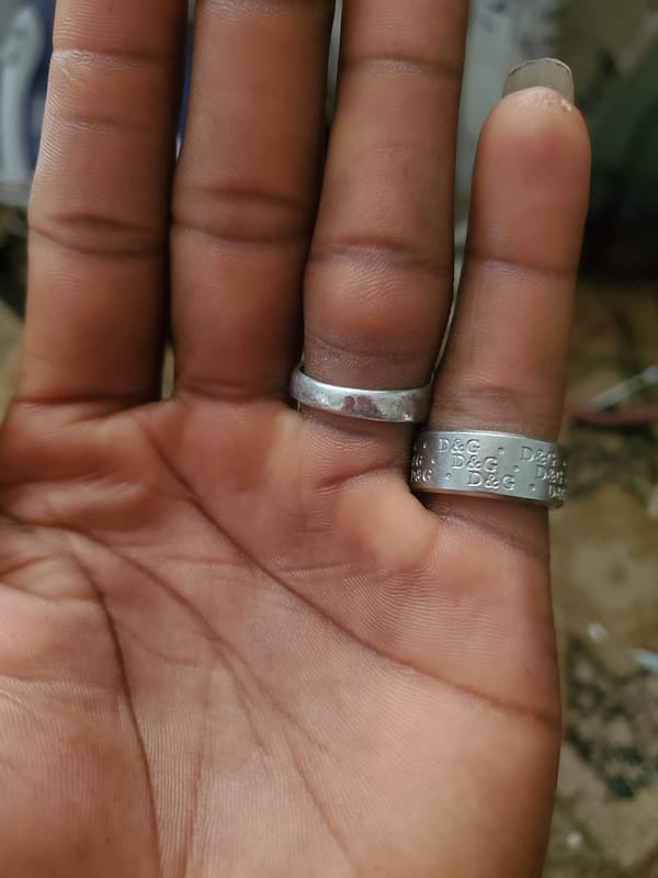 Silver rings on a hand, two angles, Jos Nigeria