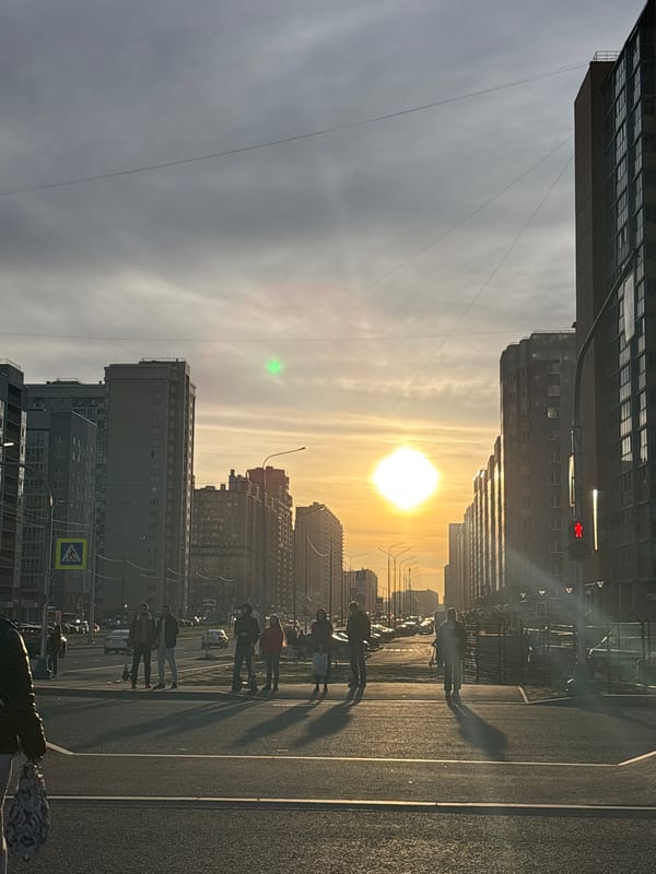Golden hour street scene observed in Murino, Russia