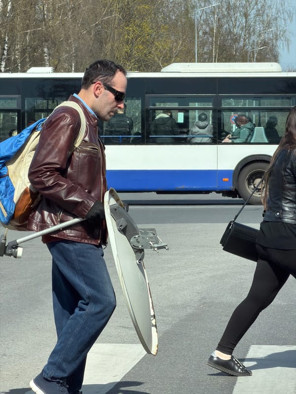 Man with satellite dish spotted near bus in Riga