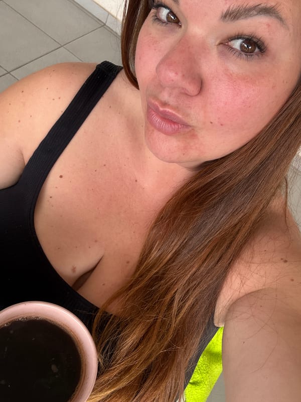 Woman with coffee mug observed in Bijela, Montenegro