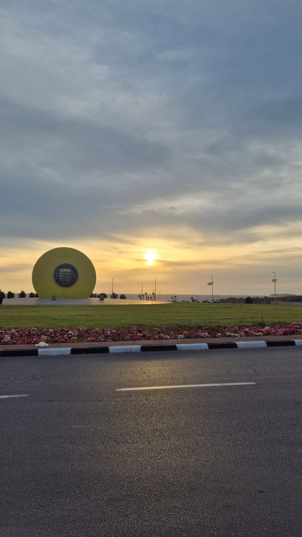 Golden sunset observed over Ashdod with warm cloudy skies