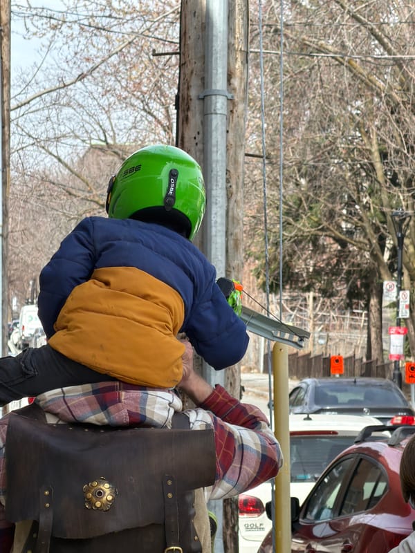 Person with toy bow spotted near wooden structure in Montreal