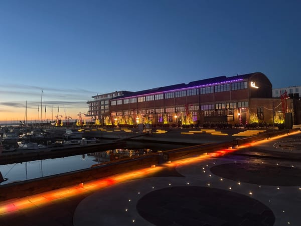 Tallinn waterfront at dusk, marinas and promenades glowing