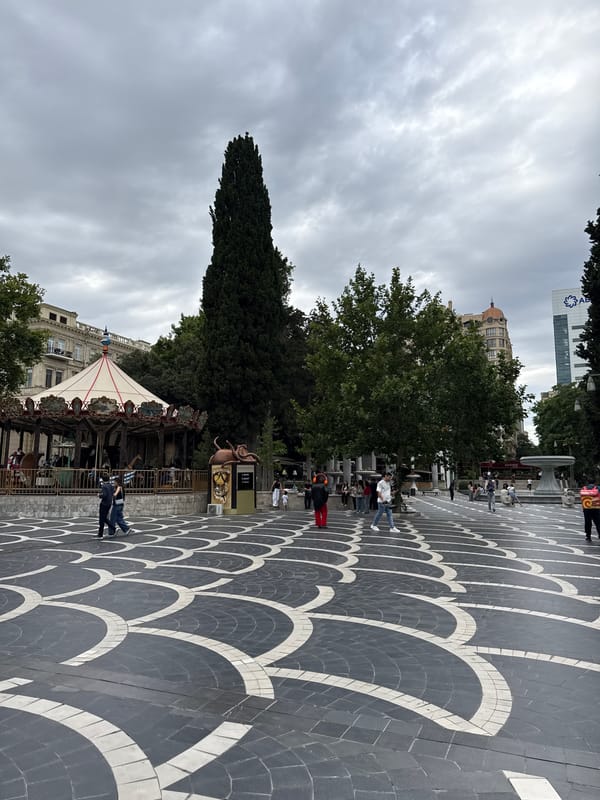 Central Baku square: carousels, monuments, and fast food side by side