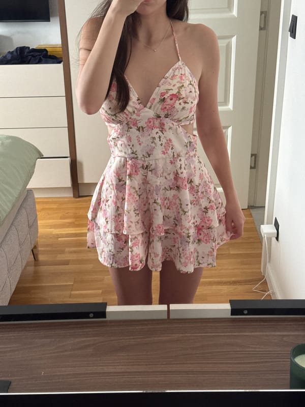 Mirror selfie session with floral dress and dog captured
