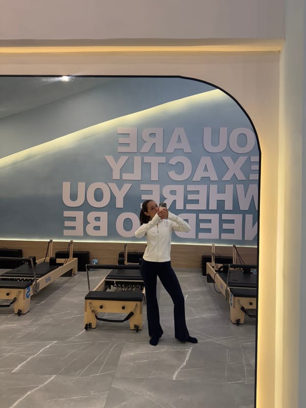 Mirror selfie inside a modern Pilates studio in Puebla