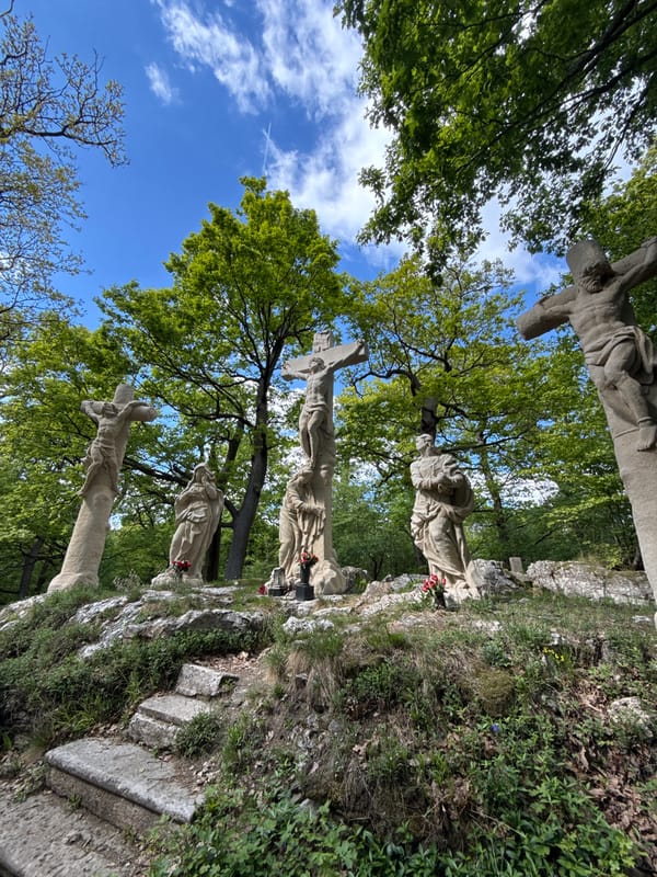 Visitor documents religious sites and sculptures in Častá, Slovakia