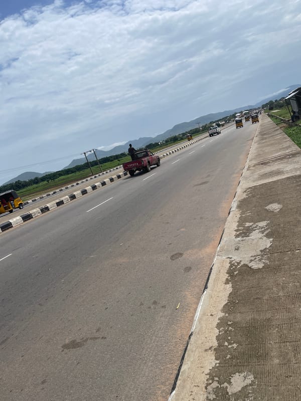 Jalingo highway life: keke traffic, construction, and open terrain