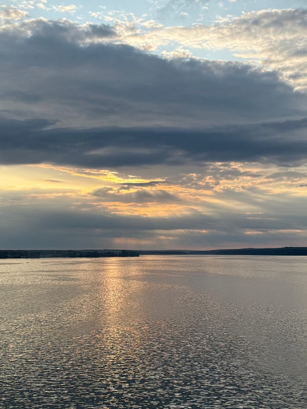 Sunset clouds break over Votkinsk Reservoir from above