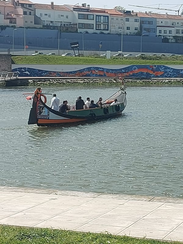 Tourist captures Aveiro's canals, moliceiro boats, and historic ceramic factory