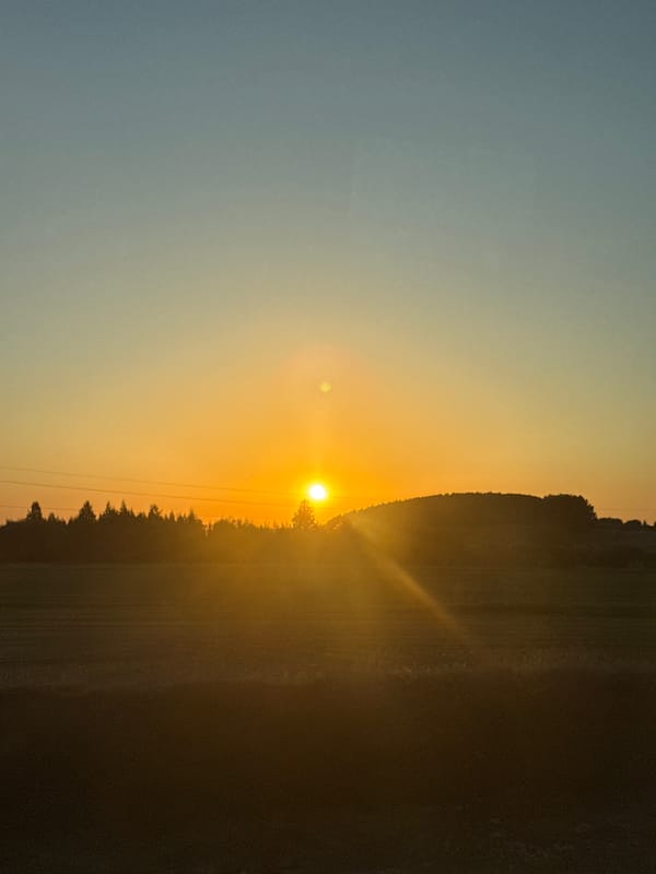 Sunset photographed through window in rural Russian village