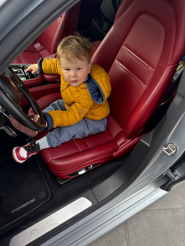 Toddler plays driver in Porsche in Belgium