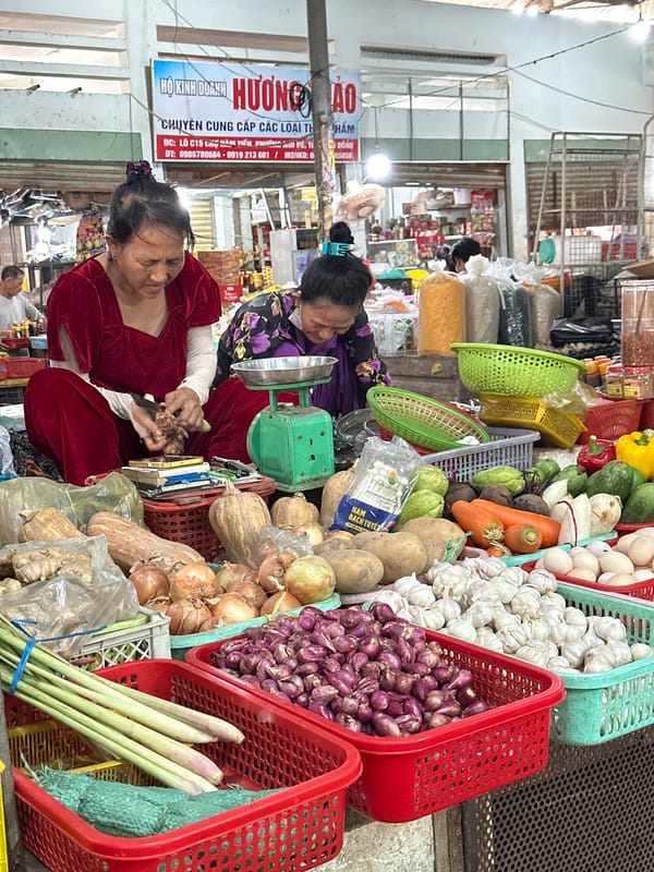 Inside a busy tropical fruit market in Mũi Né