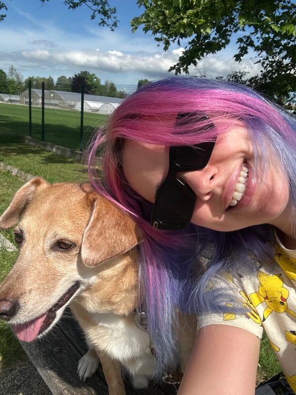 Woman with colorful hair poses with dog in Zagreb park