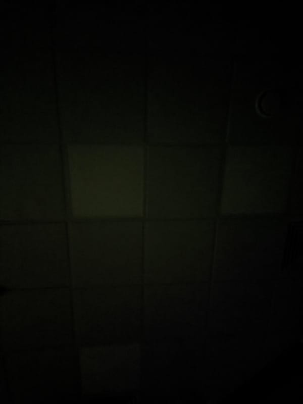Witness documents dimly lit tiled wall in Moscow