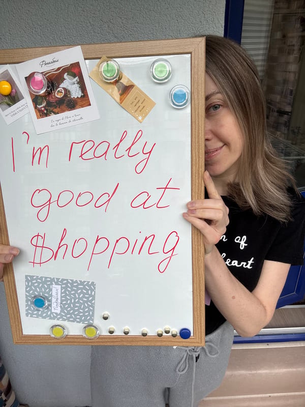 Woman writes shopping message on whiteboard in Kudrovo home