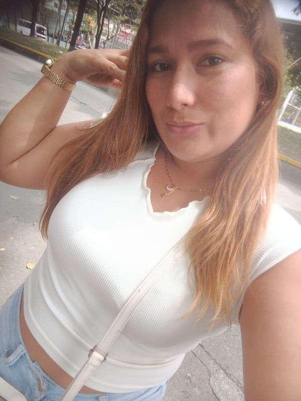 Woman takes selfies in public area of Caracas