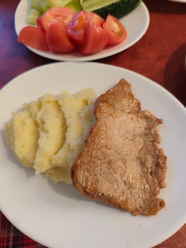 Domestic evening documented in Chaikovsky Russia includes cooking pets
