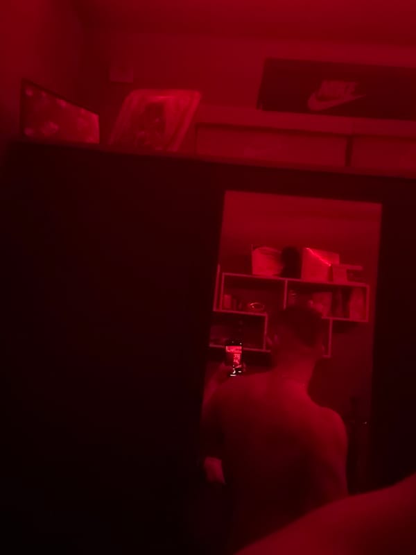 Person photographed in red-lit room in Radilovo, Bulgaria