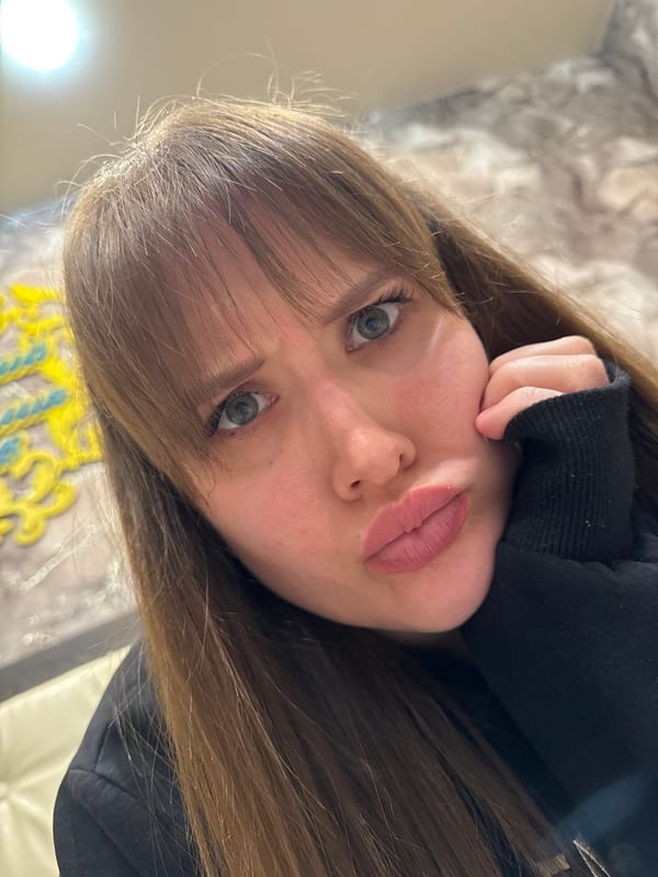 Woman photographed with Scottish Fold cat in Chaikovsky