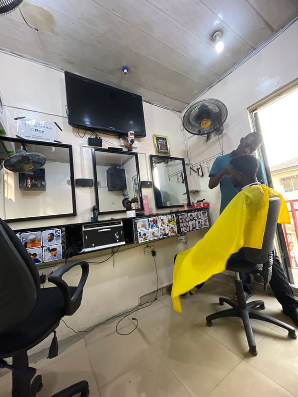 Haircut session documented at barbershop in Ado, Nigeria