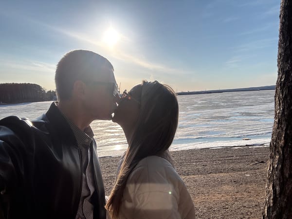 Couple shares romantic moments by frozen waterway in Chaikovsky