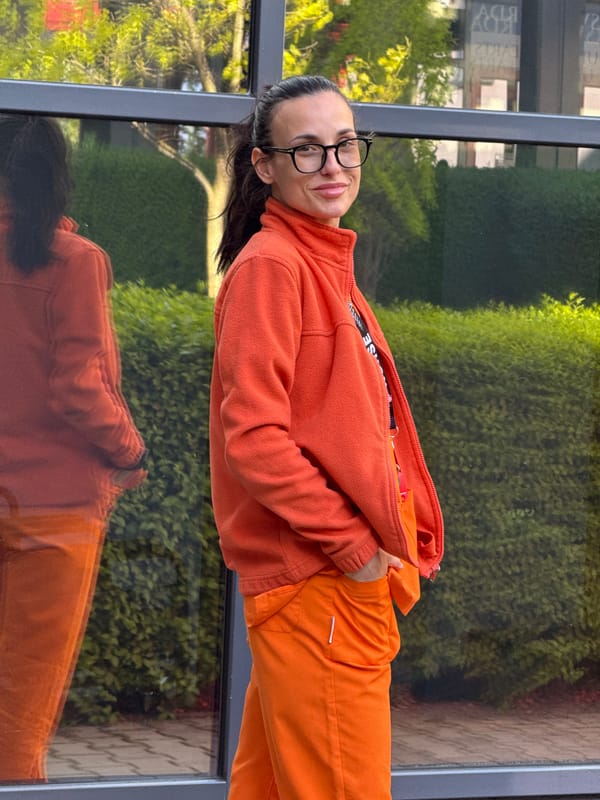 Nurse in orange scrubs documented during break time in Pleven
