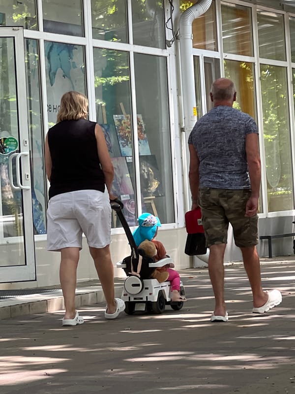 Weekday morning foot traffic along a Krasnodar commercial street