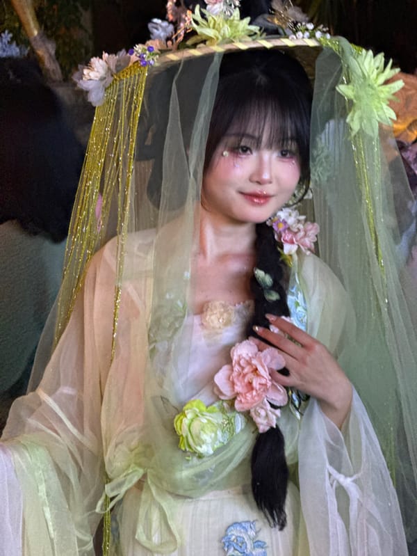 Nighttime crowds and traditional dress documented in Chongqing tourist district