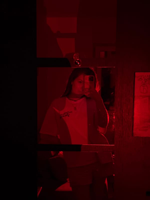 Person photographs indoor scenes with colored lighting in Belgrade