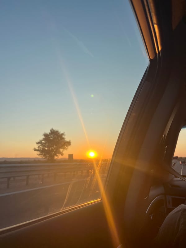 Sunset horizon seen through a car window in rural Bulgaria